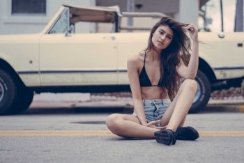 model Lisiane Witt Lisi Witt sitting in road in front of International Scout